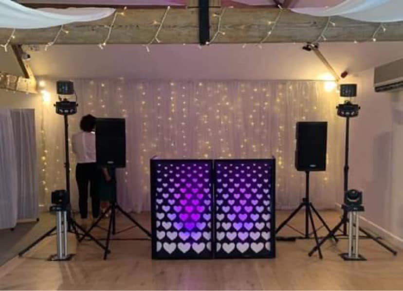 A DJ booth and lighting set up for an event in Chichester